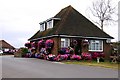 House with nice hanging baskets