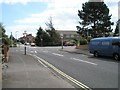 Approaching the crossroads of Western Way, Jellicoe Avenue and Village Road