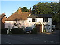 TQ9557 : Rose Cottage and Newnham Village Hall by David Anstiss