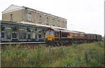 SU1485 : Freight train, passes behind Swindon station by Roger Cornfoot