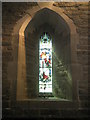 Stained glass window on the south wall at St Andrew, Hope Bowdler