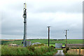 Mobile phone mast and power poles near Trenant