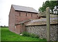 Footpath past an old barn