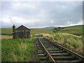 NY5698 : Railway line and platelayers hut at Saughtree Station. by Les Hull