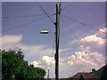 TR2968 : Telegraph pole-mounted streetlight on Quex View Road by Robert Lamb