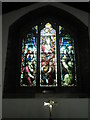 Stained glass window above the side altar at St James, Milton