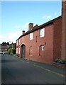 Brick building opposite the Church