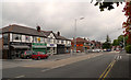 SJ8585 : Shops on Wilmslow Road by Geoff Royle