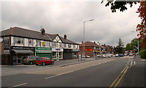 SJ8585 : Shops on Wilmslow Road by Geoff Royle