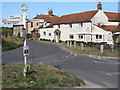 The Wiveton Bell pub and signpost