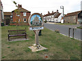 Village sign in the middle of Binham