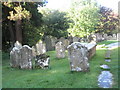 Ancient gravestones  in the churchyard at St Mary, Buriton