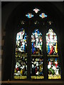 Stained glass window above the altar at St Bartholomew, Rogate