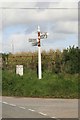 SX1854 : Cornish Signpost and old milepost by roger geach