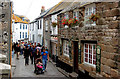 Visitors strolling in Fore Street, St Ives