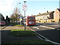 Bus passing mini-roundabout in Middle Park Way