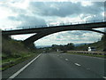 Unusual shaped bridge crossing A38 near Filleigh