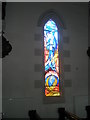 Stained glass window on the south wall at  St Coleman