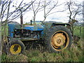 Abandoned tractor near Newbrough Lodge