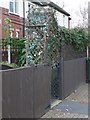 Trellis arch, decorated with plastic flowers