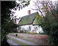 TM2185 : Thatched cottage east of St Mary's church by Evelyn Simak