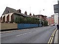 Houses behind the hoarding