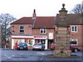 Village shop and ornamental fountain