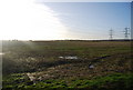 Muddy field near Kingsnorth Power Station