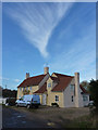 Stackhouse farmhouse and sky with cirrus