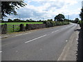 The B5130 and a stone stile