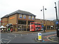 Bus passing Sainsbury