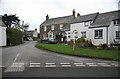 St Tudy Cottages and attractive signpost