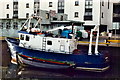 M2924 : Galway - Small ship in harbour along Dock Street by Joseph Mischyshyn