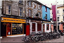 M2925 : Galway - Mainguard Street - Shops and Dew Drop Inn by Joseph Mischyshyn