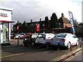 Car showroom at the corner of Figgins Lane