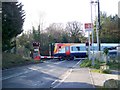 Train on the level crossing, Moreton