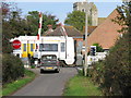 Passing train over level crossing, Marsh Farm Road