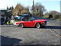 Sports car emerging from Elsted Station onto the Harting road