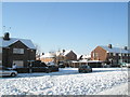 Looking from a snowy Colbury Grove across Linkenholt Way towards Grateley Crescent