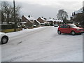 Red car turning from Lower Drayton Road into Dysart Avenue