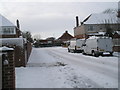 Approaching the junction of a snowy Mansvid Avenue and Court Lane