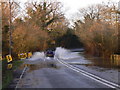 Traffic negotiates flooding at Mock Bridge