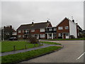 Approaching the junction of Hawley and Harsfold Roads