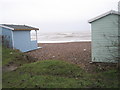 Looking between the beach huts on Broadmark Beach