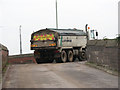 Highway maintenance lorry leaving Lafarge Aggregates depot