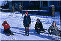 SD7442 : Children sledging in the street, 1969 by Frederick W Craven