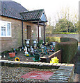 Garden ornaments in front of bungalow in Church Avenue