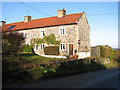 Flint and stone cottage in The Street