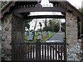 View through the lych gate to the graveyard of Rockbeare Church