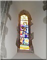 Small stained glass window on the north wall at St Mary, East Worldham